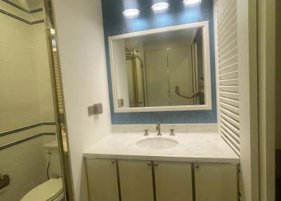 Modern bathroom with vanity and overhead lighting