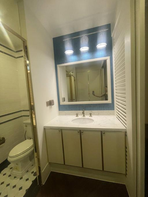 Modern bathroom with vanity and overhead lighting