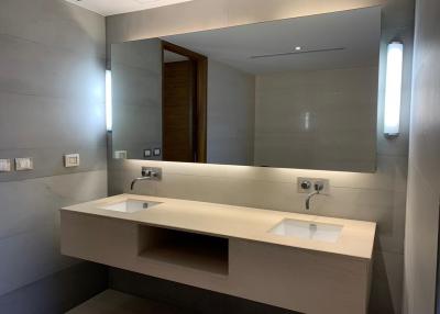 Modern bathroom with double sink and large mirror