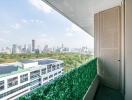 Spacious balcony with synthetic grass overlooking the city skyline