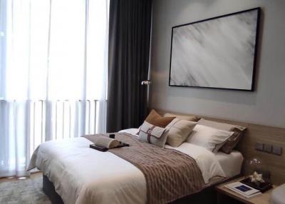 Modern bedroom interior with king-sized bed and artwork