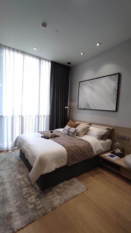 Modern bedroom interior with king-sized bed and artwork