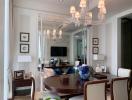 Elegant living room with dining area and mirrored wall