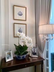 Elegant living room corner with decorative wall art and chic console table