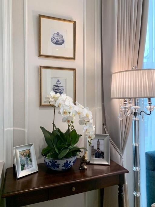 Elegant living room corner with decorative wall art and chic console table