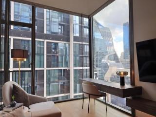 Modern living room with large windows and city view