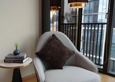 Modern living room with stylish armchair and natural light