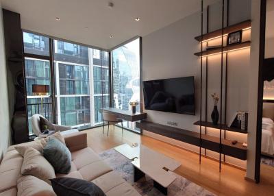 Modern living room with large windows and contemporary furniture