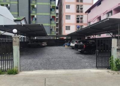 Apartment complex parking area with security gate