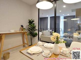 Modern dining area with open plan leading to the living room