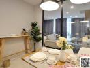 Modern dining area with open plan leading to the living room