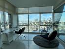 Bright and modern living room with large windows and city view