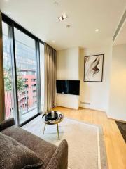 Modern living room with large windows and comfortable seating