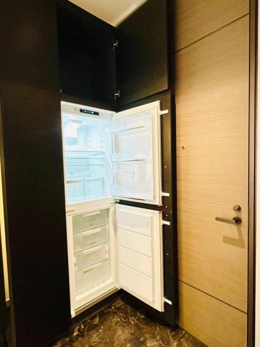 Open refrigerator in a modern kitchen interior