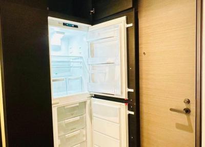 Open refrigerator in a modern kitchen interior