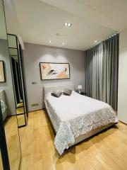 Cozy modern bedroom with wooden flooring