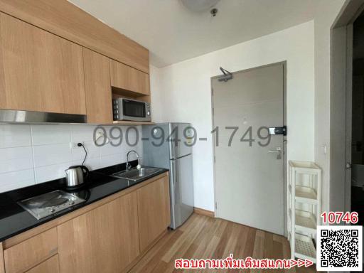 Modern kitchen with wooden cabinets and stainless steel appliances