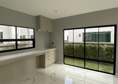 Modern kitchen with large windows and garden view