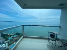 Balcony with ocean view and seating area