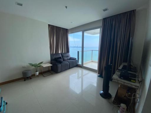 Spacious living room with large windows and ocean view