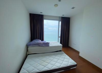 Spacious bedroom with ocean view and ample natural light