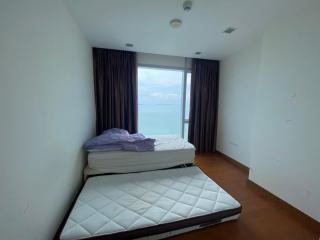 Spacious bedroom with ocean view and ample natural light