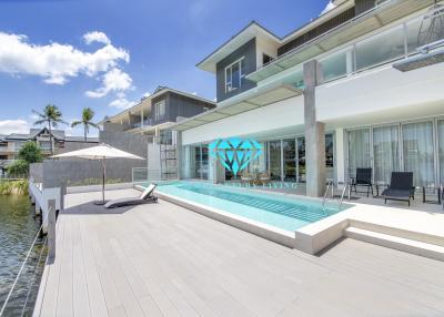 Modern house exterior with swimming pool and deck