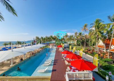 Luxurious resort-style swimming pool with ocean view