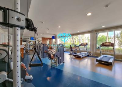 Spacious home gym with modern equipment and ample natural light