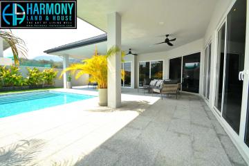 Spacious outdoor patio with swimming pool and sitting area