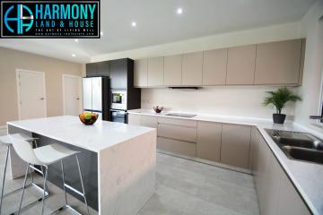 Modern spacious kitchen with island and integrated appliances