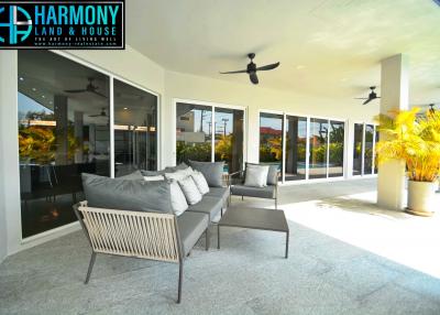 Spacious outdoor patio area with comfortable seating and large sliding glass doors