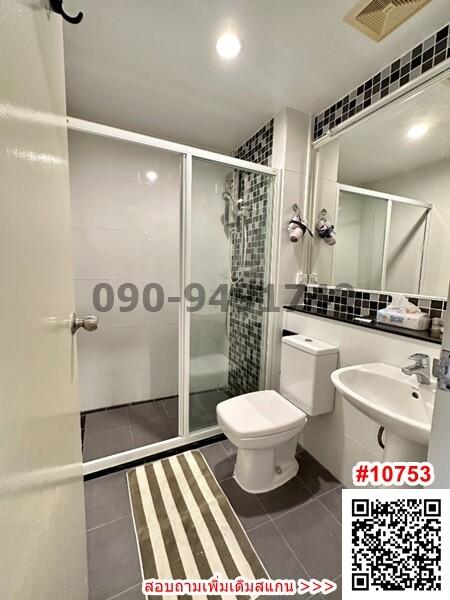 Modern bathroom interior with glass shower and tiled flooring