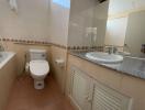 Spacious bathroom with modern amenities and natural light