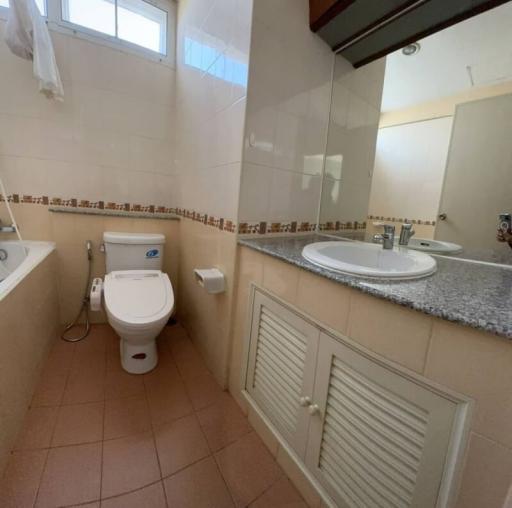 Spacious bathroom with modern amenities and natural light