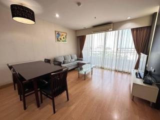 Elegant living room with dining area and hardwood floors