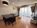 Elegant living room with dining area and hardwood floors