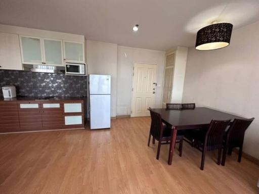 Spacious kitchen with modern appliances and dining area