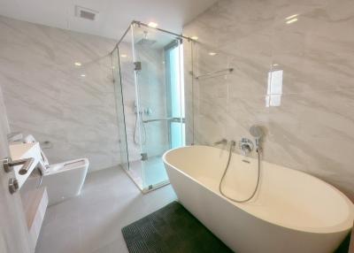 Modern bathroom with freestanding tub and glass shower