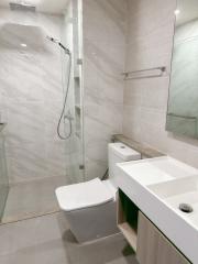 Modern bathroom with walk-in shower and white fixtures