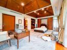 Spacious and well-lit master bedroom with elegant wooden furnishings and attached bathroom