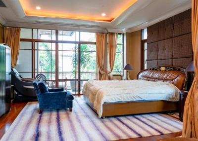 Spacious bedroom with modern furniture and ample light