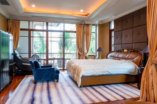 Spacious bedroom with modern furniture and ample light