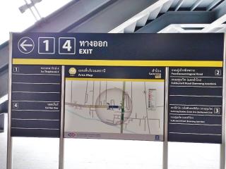 Directional sign at a transit station with area map and exit information