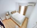 Cozy bedroom with white beddings and natural light