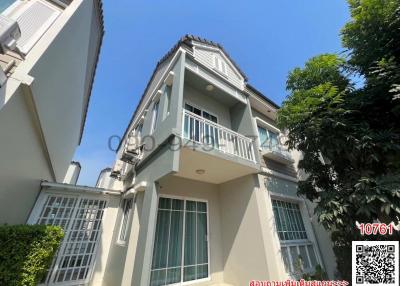 Exterior view of a two-story residential building with balcony