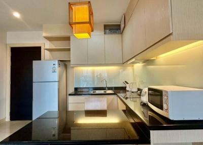 Modern kitchen with stainless steel appliances and LED lighting