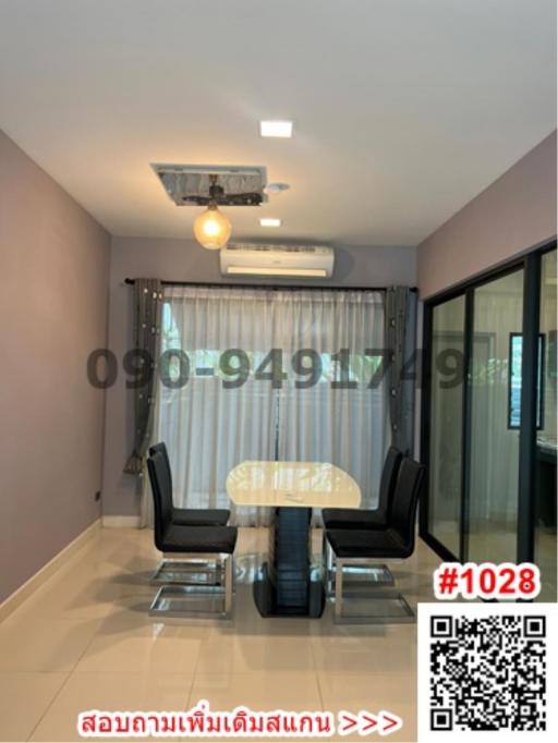 Contemporary dining area with air conditioning and tiled flooring