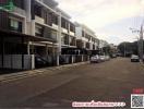 Exterior view of modern residential townhouses with parking spaces