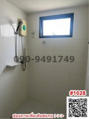 Bright bathroom with electric water heater and small window